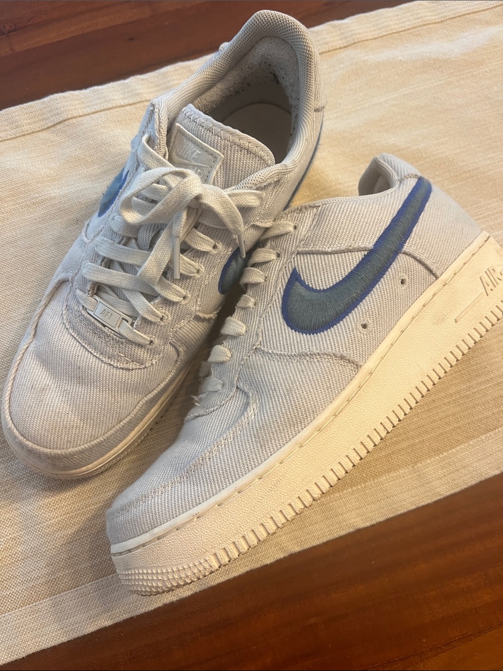 Nike Men’s Light Gray Canvas Sneakers with Blue Swoosh